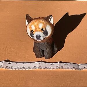 The smallest of racoon stuffies. Cute bin tosser